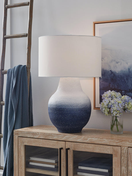 Ashley Furniture Dashland table lamp with a sleek base and fabric shade, perfect for modern living room or bedroom decor.