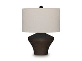 Dolanham table lamp by Ashley Furniture with a sleek base and fabric shade, ideal for modern living room or bedside lighting.