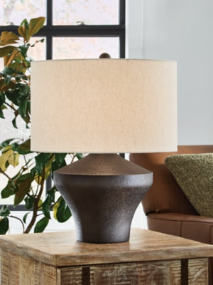 Ashley Furniture Dolanham table lamp with a sleek base and fabric shade, perfect for modern living room or bedroom decor.