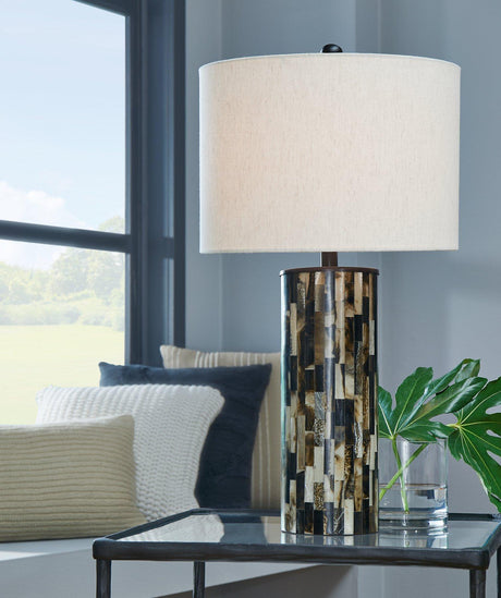 Ellford table lamp by Ashley Furniture with a modern design, featuring a sleek base and a fabric lampshade for stylish lighting.
