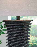 Ashley Furniture Golzar table lamp with a stylish design and fabric shade, perfect for enhancing living room or bedside decor.