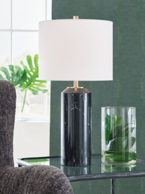 Ashley Furniture Hanzila table lamp with a sleek base and fabric shade, ideal for modern bedroom or living room décor.