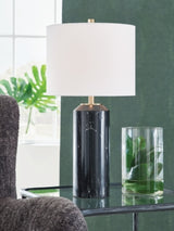 Ashley Furniture Hanzila table lamp with a sleek base and fabric shade, ideal for modern bedroom or living room décor.