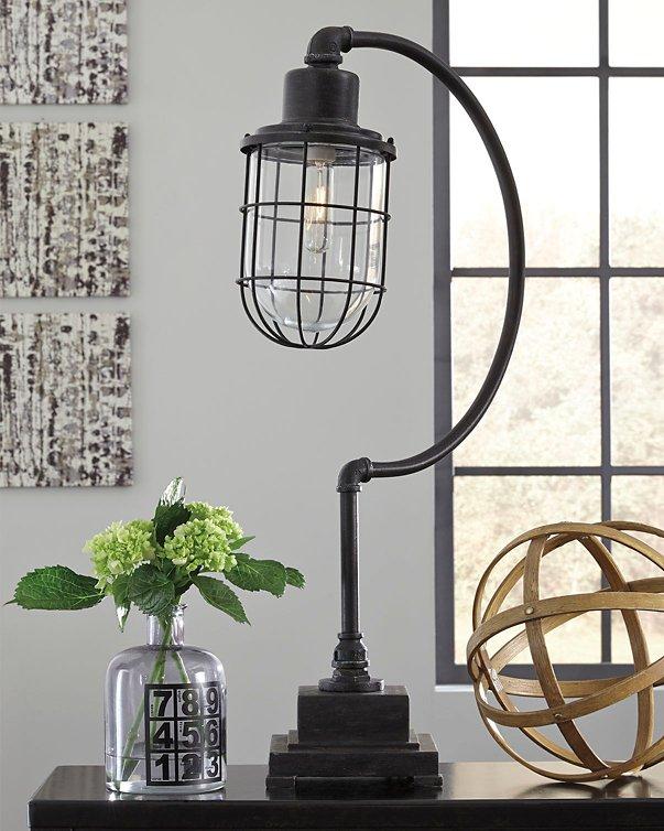 Ashley Furniture Jae Desk Lamp, modern table lamp with sleek design and neutral finish on a desk surface.