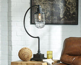 Ashley Furniture Jae desk table lamp with a sleek design, featuring a modern base and soft white lampshade.
