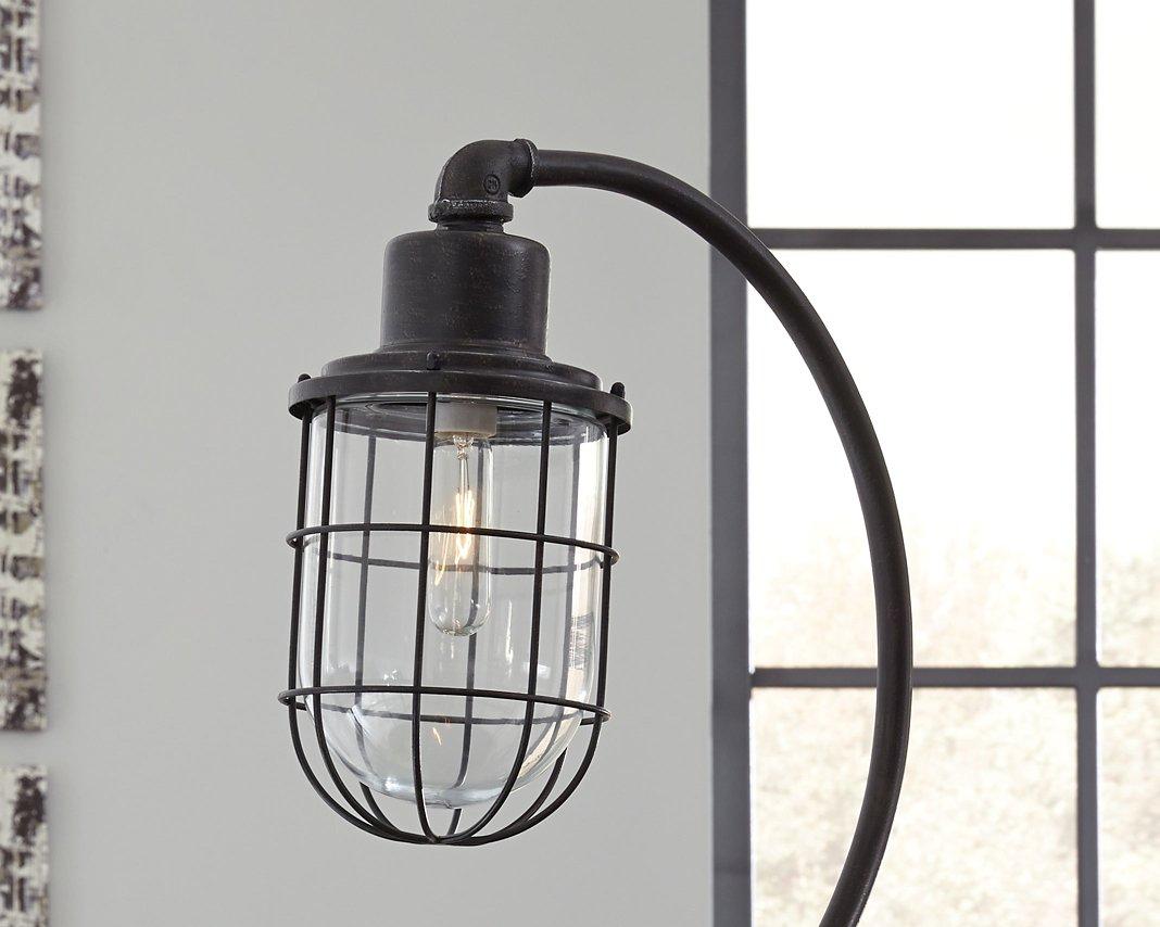 Ashley Furniture Jae Desk Lamp, modern table lamp with sleek design and adjustable arm on a wooden desk.