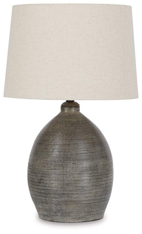 Joyelle table lamp by Ashley Furniture featuring a sleek base and fabric shade, ideal for modern living room or bedside lighting.