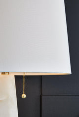 Ashley Laurellen table lamp with a sleek base and fabric shade, perfect for living room or bedroom decor.