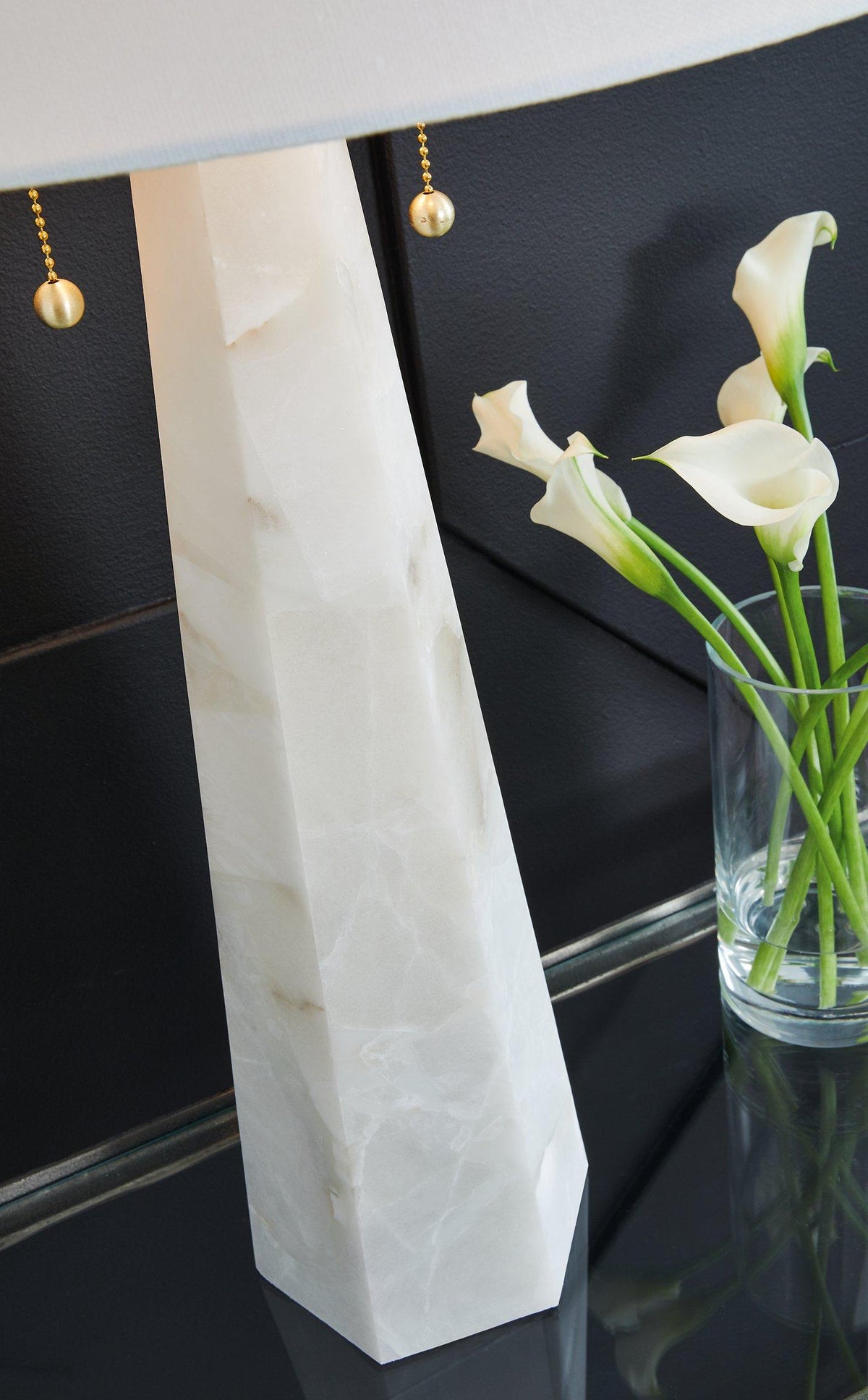 Ashley Furniture Laurellen table lamp with a sleek base and fabric shade, ideal for living room or bedroom decor.