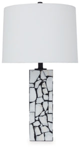Ashley Furniture Macaria table lamp with a sleek design, featuring a beige fabric shade and a sturdy base for stylish lighting.