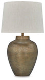Madney table lamp by Ashley Furniture featuring a sleek ceramic base and a classic fabric lampshade on a wooden table.