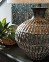 Ashley Furniture Magan table lamp with a modern design and fabric shade, ideal for enhancing living room or bedroom decor.