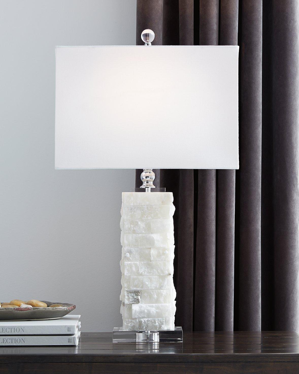 Ashley Furniture Malise table lamp with a sleek design, featuring a fabric shade and modern base for stylish home lighting.