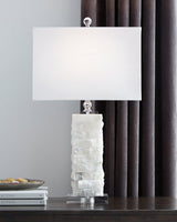 Ashley Furniture Malise table lamp with a sleek design, featuring a fabric shade and modern base for stylish home lighting.