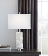 Malise Table Lamp by Ashley Furniture featuring a sleek ceramic base and fabric shade, ideal for modern living room decor.