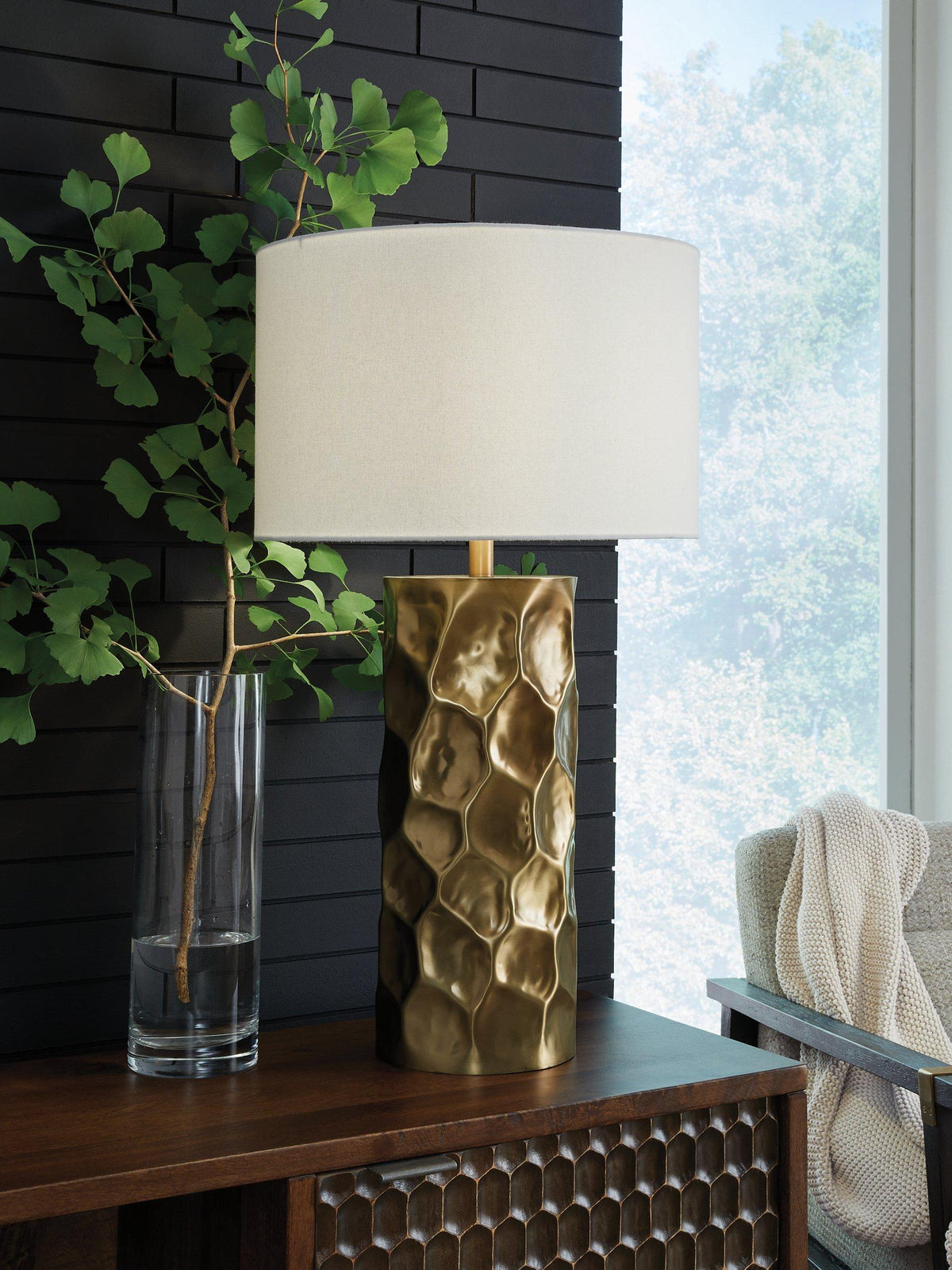 Marshawn table lamp by Ashley Furniture featuring a sleek base and fabric lampshade, ideal for modern living room decor