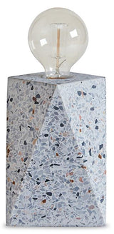 Maywick Table Lamp by Ashley Furniture featuring a sleek design with a fabric shade and a sturdy base, ideal for bedside or living room.