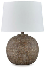 Neavesboro Ashley Furniture table lamp with a classic design featuring a fabric shade and wooden base on a wooden table.