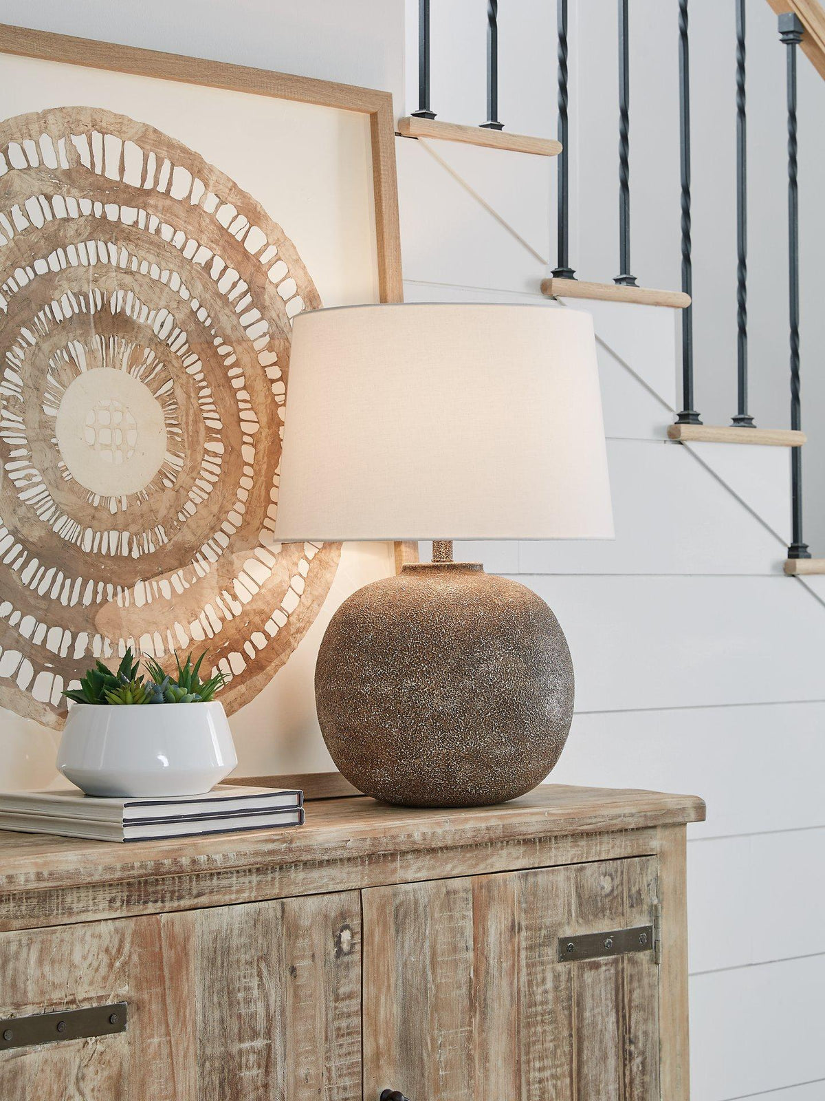 Ashley Furniture Neavesboro table lamp featuring a classic design with a white fabric shade and wooden base.