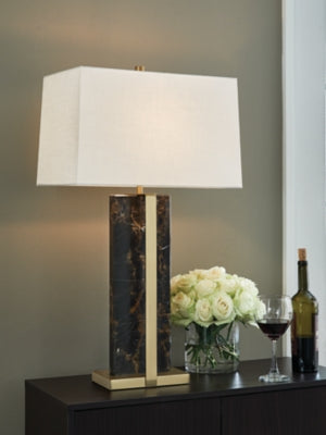Neonish table lamp by Ashley Furniture with a modern design, featuring a sleek base and vibrant illuminated shade.
