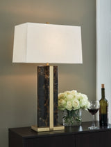 Neonish table lamp by Ashley Furniture with a modern design, featuring a sleek base and vibrant illuminated shade.