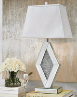 Prunella Table Lamp by Ashley Furniture featuring a stylish design with a fabric shade and wooden base, perfect for modern decor.