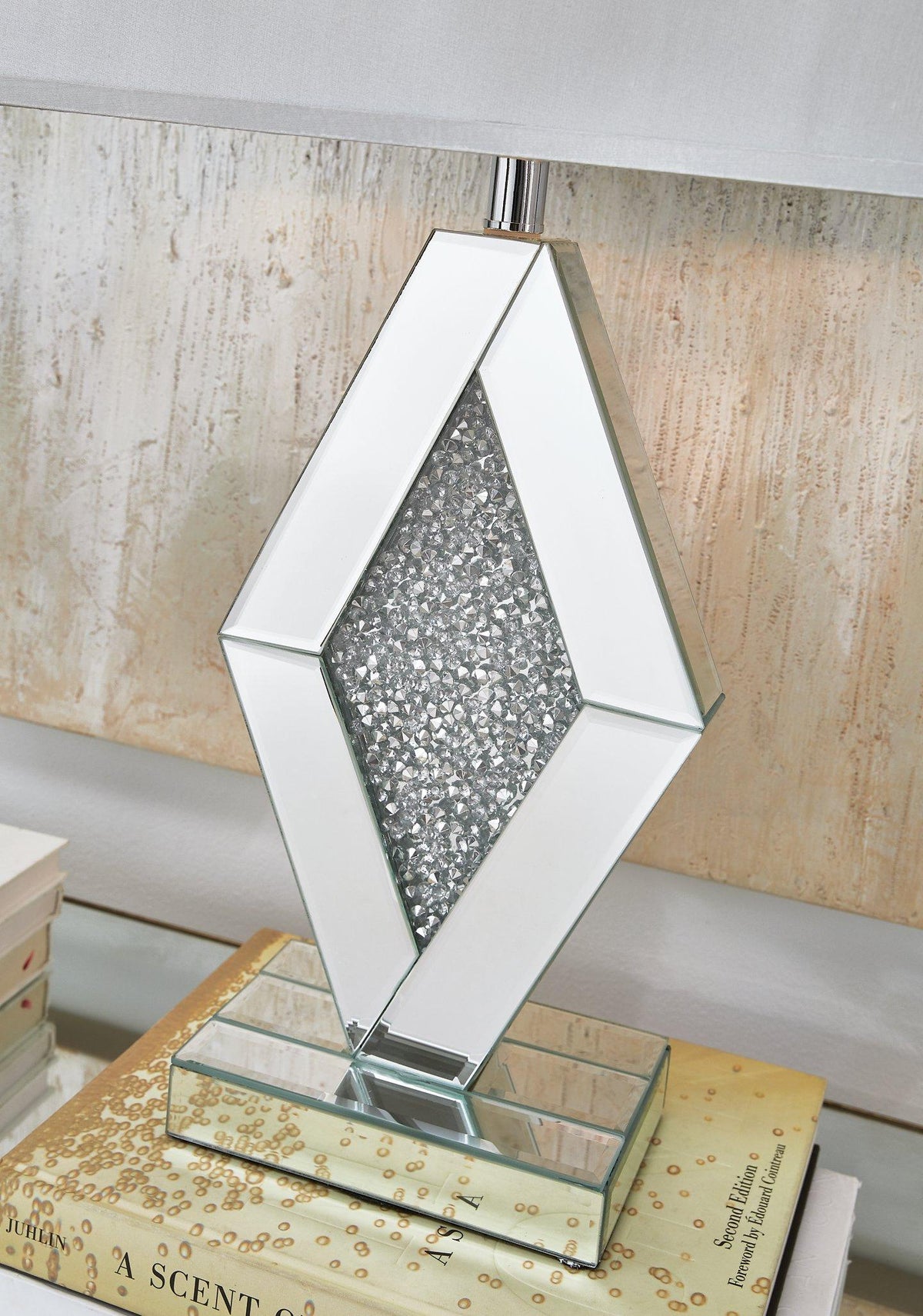 Prunella Table Lamp by Ashley Furniture featuring a sleek modern design with a fabric shade and ceramic base.
