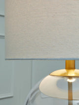 Ashley Furniture Samder table lamp with a sleek base and fabric shade, ideal for stylish home lighting.