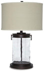 Tailynn table lamp by Ashley Furniture featuring a modern design with a sleek base and fabric shade.