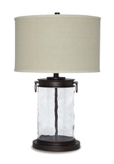 Ashley Furniture Tailynn table lamp with a sleek base and fabric shade, ideal for living room or bedside decor.