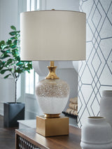 Ashley Furniture Tavisburg table lamp with a sleek base and fabric shade, perfect for living room or bedside lighting.