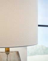 Ashley Furniture Taylor Table Lamp with a sleek base and fabric shade, ideal for enhancing living room or bedside decor.
