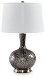 Ashley Furniture Tenslow table lamp with a sleek metal base and fabric shade, placed on a modern wooden side table.