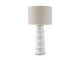 Ashley Furniture Veraleigh table lamp with a beige fabric shade and a sleek ceramic base, perfect for modern home decor.