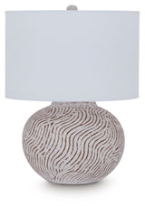 Decorative Ashley Furniture Vien Table Lamp with a sleek base and fabric shade, ideal for adding style to a living space.