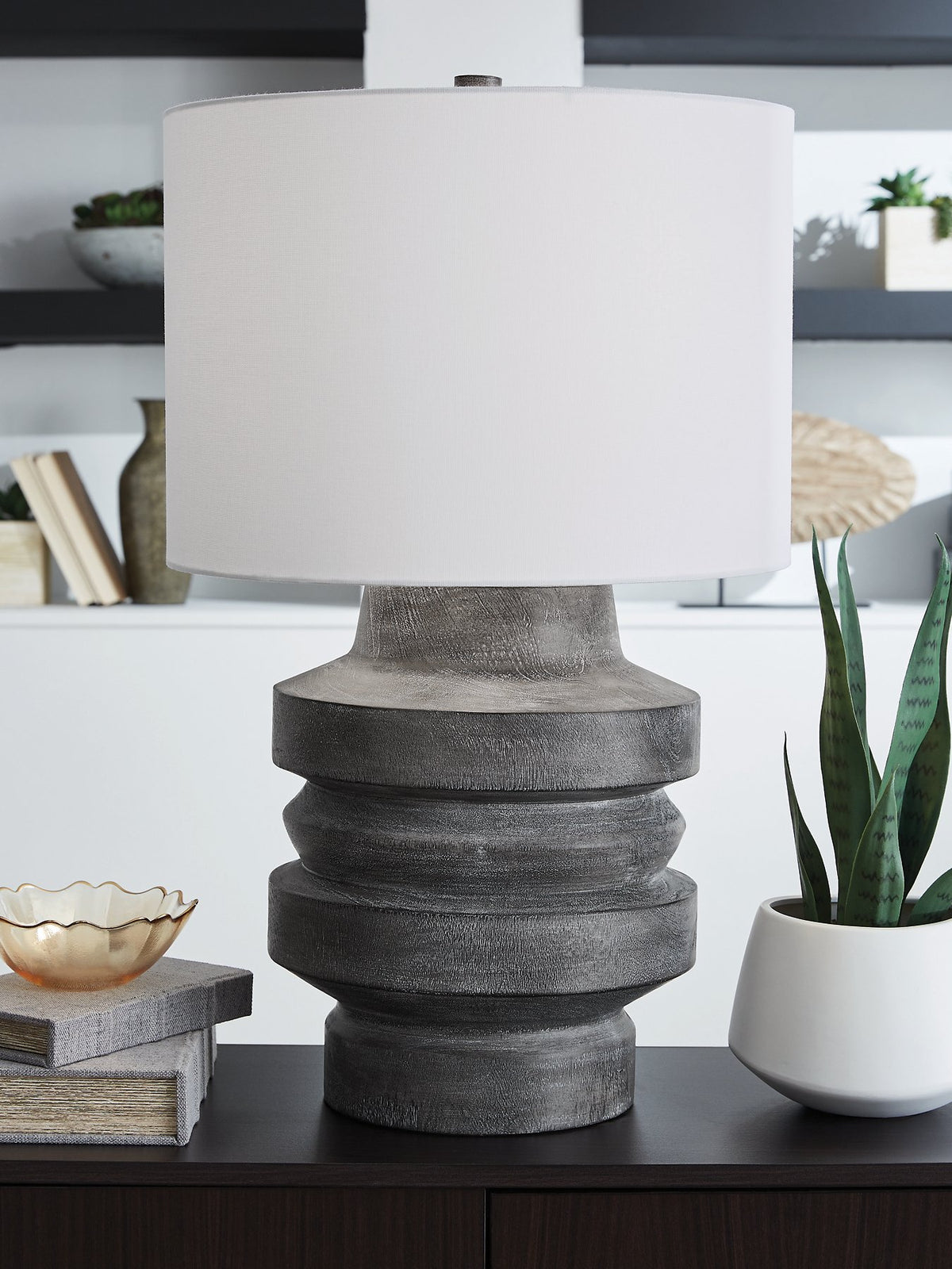 Ashley Furniture Wahida table lamp with a modern design, featuring a sleek base and fabric shade, ideal for living room or bedside.