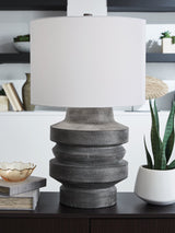 Ashley Furniture Wahida table lamp with a modern design, featuring a sleek base and fabric shade, ideal for living room or bedside.