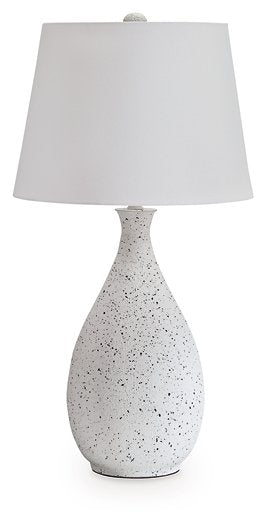 Ashley Furniture Wyattford table lamp with a sleek design, featuring a neutral-colored shade and a sturdy base.