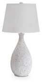 Ashley Furniture Wyattford table lamp with a sleek design, featuring a neutral-colored shade and a sturdy base.
