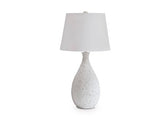 Ashley Furniture Wyattford table lamp with a sleek base and fabric shade, perfect for modern bedroom or living room decor.