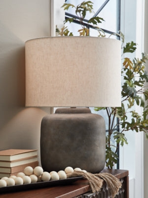 Ashley Furniture Zandophen table lamp with a sleek base and fabric shade, perfect for enhancing living room or bedroom decor.
