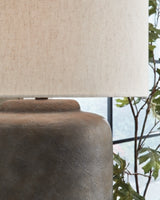 Ashley Furniture Zandophen table lamp with a sleek base and fabric shade, perfect for adding style to living room or bedside.