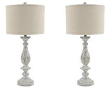 Pair of Ashley Furniture Bernadate table lamps, featuring elegant fabric shades and decorative bases, perfect for bedside or living room.