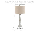 Pair of Ashley Furniture Bernadate table lamps with fabric shades and decorative bases on a wooden surface.
