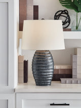Pair of Ashley Furniture Caronick table lamps with fabric shades and wooden bases, ideal for bedside or living room decor.