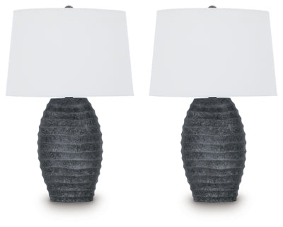 Pair of Ashley Furniture Caronick table lamps with beige fabric shades and dark bronze bases, designed for stylish home lighting.