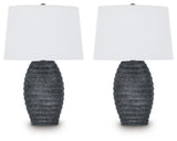 Pair of Ashley Furniture Caronick table lamps with beige fabric shades and dark bronze bases, designed for stylish home lighting.