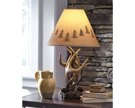 Pair of Ashley Furniture Derek table lamps with beige fabric shades and sleek bronze bases on a wooden side table.