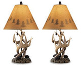 Pair of Ashley Furniture Derek Table Lamps with fabric shades, featuring a modern design and warm lighting.