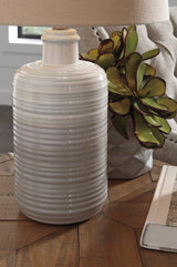 Pair of Ashley Furniture Marnina table lamps with fabric shades and decorative bases, ideal for bedside or living room lighting.